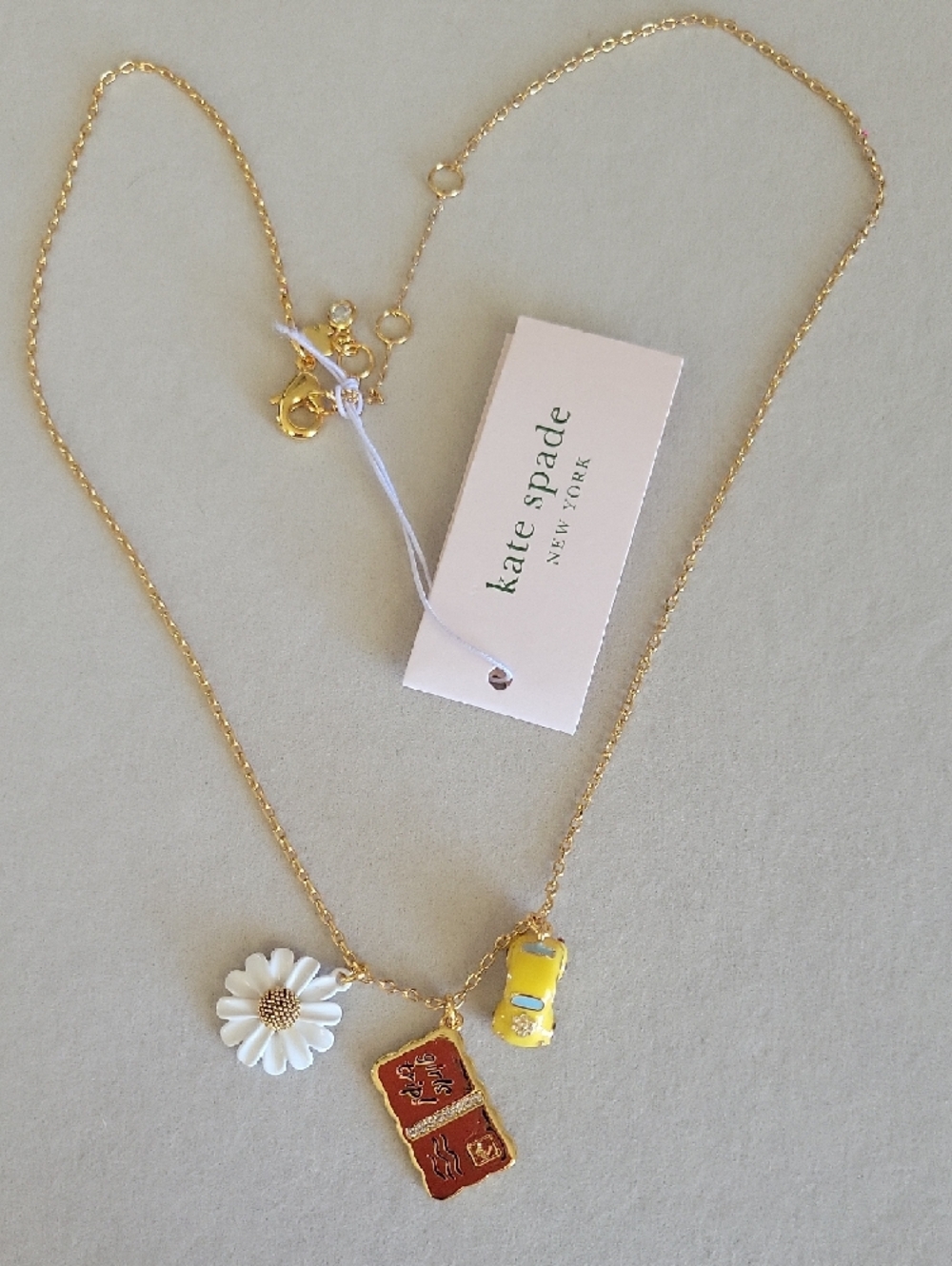 Kate Spade Gold Chain Necklace with Daisy, Yellow Car & 'Girls Trip' Charm - Picture 3 of 8